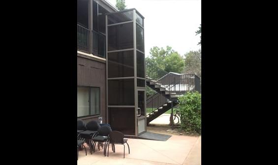 Exterior vertical wheelchair lift